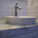 White bathroom tile backsplash