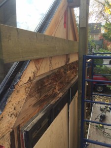 side view of rotted beam before replacement