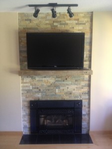 modern entertainment centre with stone wall